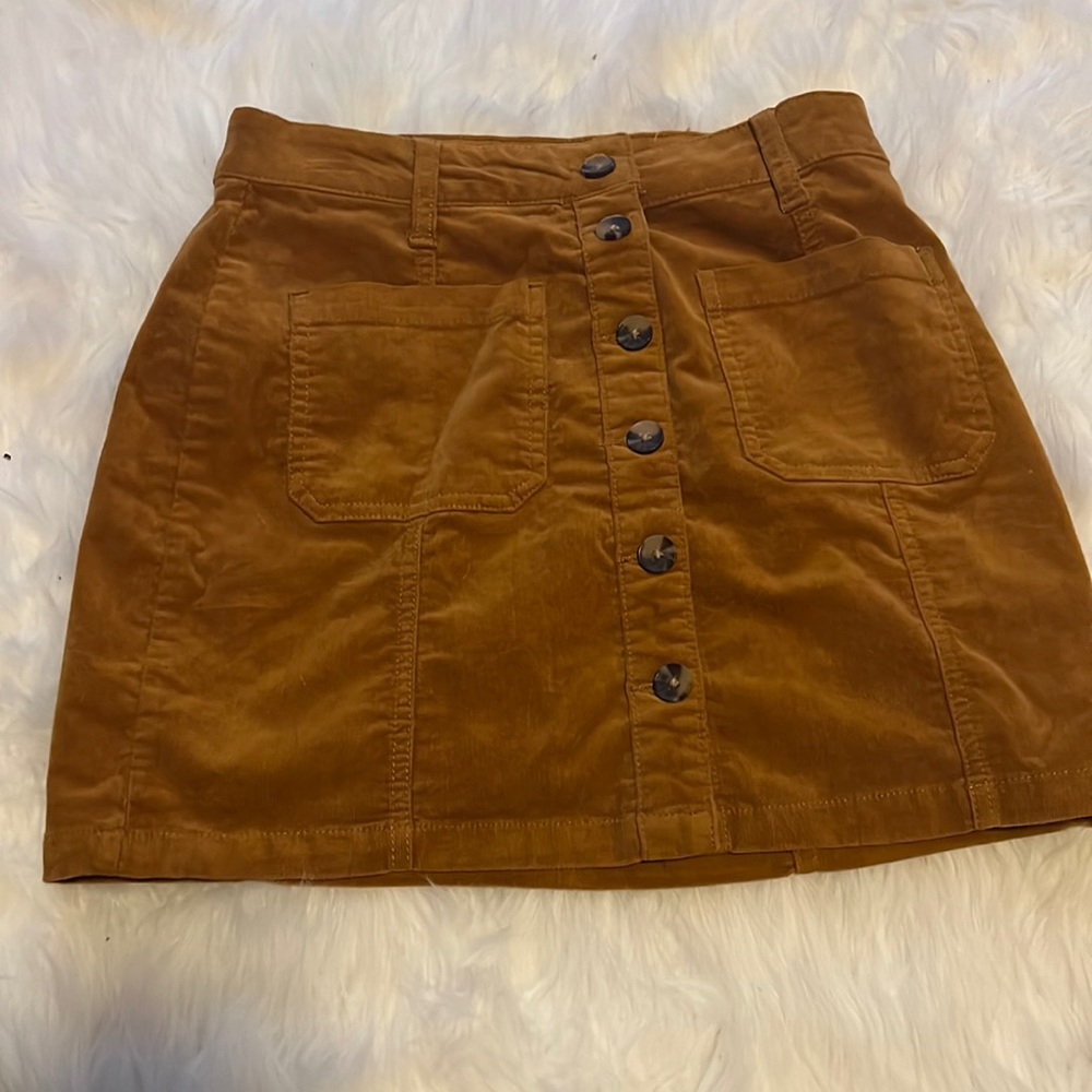 So, size 5/27W jean skirt, burnt orange color, buttons unbutton